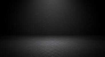 Black background with light shining from the ceiling photo