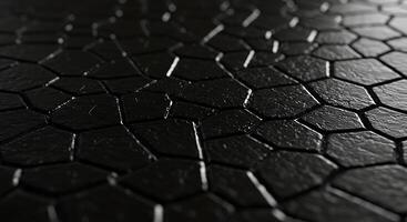A black surface with a pattern of cracks photo
