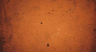 An orange background with some scratches and dirt photo