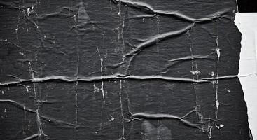 Black and white photograph of a piece of paper with cracks photo