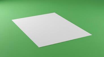 Blank paper on a green background photo