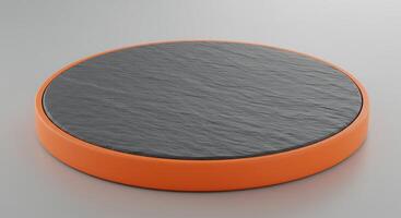 A black and orange round object on a white surface photo