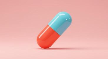 A pill on a pink background with a blue and red top photo