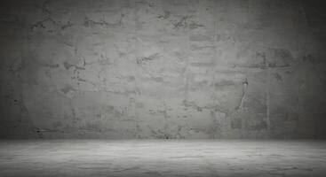 An empty room with a concrete wall and cement floor photo
