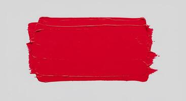 un rojo pintar cepillo en un blanco antecedentes foto