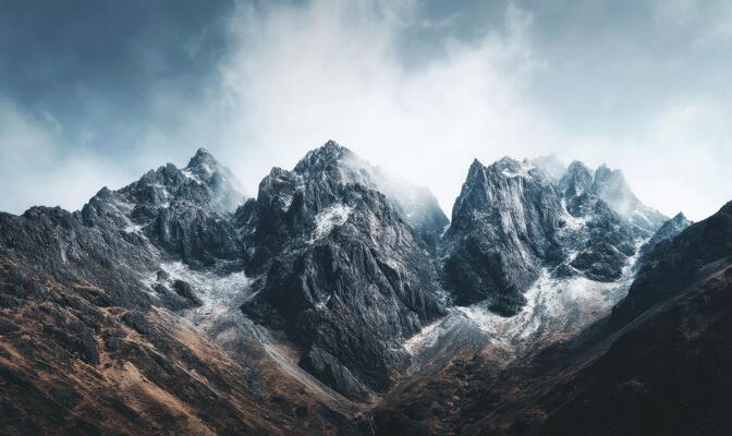 Majestic Mountain Peaks Under Dramatic Skies A Landscape of Natural Beauty and Wonder