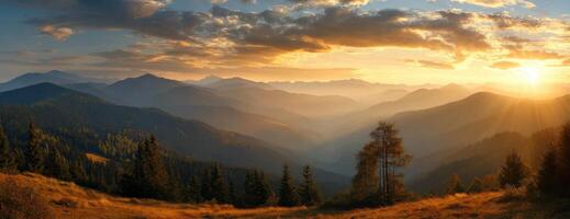 Picturesque mountain landscape panorama during sunset with golden light across vast valleys photo