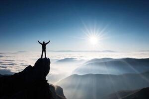 A Person Standing on Top of a Mountain with Arms Raised High Achievement photo