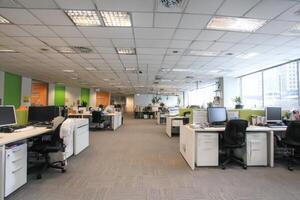 An Open Office With Office Chairs And Computers In A Modern Interior photo