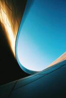 Architectural Marvel A Unique Structure Design Shining Under The Sun Light Sky photo