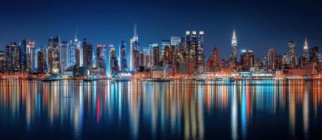 Cityscape at Night Reflected on Water With Lights On Buildings Scenery photo
