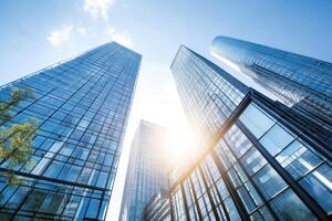Modern Office Buildings Stand Tall Against the Blue Sky with Gleaming Windows photo