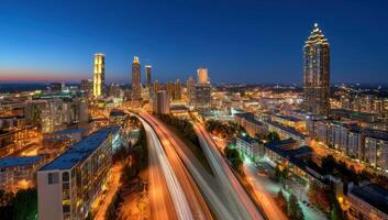 The Georgia Metropolis Cityscape Illuminated at Night Sky with High Towers photo