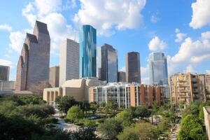 Houston skyline with trees and buildings photo