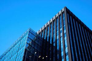 Modern office building with blue sky background photo