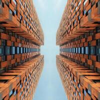 Symmetrical Modern Brick Buildings Touching the Sky Near the Top photo