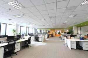 An Open Office Space with Modern Furnishings and Bright Lighting photo