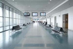 Airport Terminal Interior with Seating Area and Displays photo