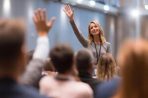 Successful Woman Speaker Engages Audience At Business Seminar Or Corporate Presentation photo