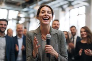 Young Woman Gives Inspiring Presentation to Enthusiastic Audience In Modern Convention Center photo
