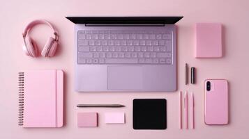 Stylish Pink Aesthetic Workspace Flat Lay with Laptop and Accessories for Productivity photo