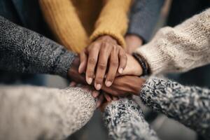 Teamwork and Collaboration a United Group of Diverse Hands Joining Together photo