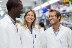 Team of Three Healthcare Professionals Collaborating Together at Pharmacy or Hospital Setting photo