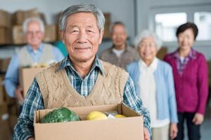 A Group of Mature People Volunteering and Holding Food Donation Boxes Together photo