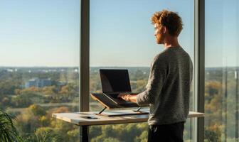 Inspiring Workspace A Man's Standing Desk View of the City Skyline photo