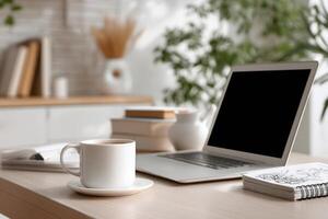 A bright workspace with laptop plants and coffee on a wooden table photo