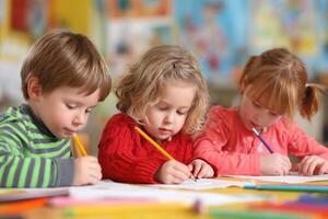 Focused Young Learners Engaged in Drawing Activities in a Classroom Setting Here photo