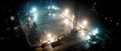 A Platform with a Tower and Several Lights in the Dark Night photo