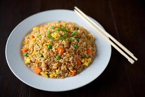 Chinese fried rice with vegetables and carrots photo