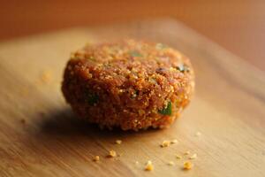 A small food item on a wooden cutting board photo