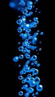 Abstract Blue Bubbles Floating on Black Background Liquid Texture Water Droplets Close Up Macro photo