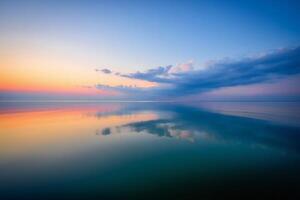 Nature Background Serene Sunset Reflection Tranquil Ocean at Dusk Colorful Sky Mirror photo