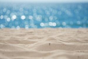 Beach Background Serene Beach Scene Soft Sand and Sparkling Ocean Bokeh Background photo