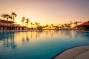 Beach Background Serene Sunset Over Resort Pool Tropical Vacation Idyll Blurred Background photo