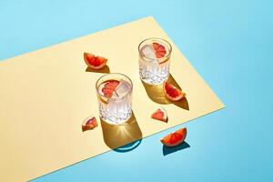 Beach Background Refreshing Grapefruit Cocktails on Pastel Background Summer Drinks Photography photo