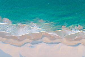 Beach Background Stunning Aerial View of Turquoise Ocean Waves Crashing on Pristine White Sandy Beach photo