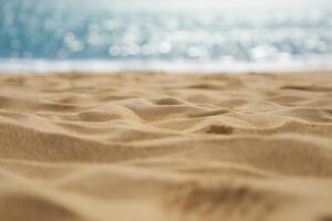 Beach Background Golden Beach Sand Texture with Blurred Ocean Background Summer Vacation Scene photo