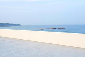 Beach Background Coastal View from Modern Terrace Ocean Rocks Minimalist Architecture photo