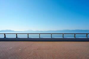 Beach Background Serene Seascape Brick Pathway Ocean View Metal Railing Calm Blue Sky photo