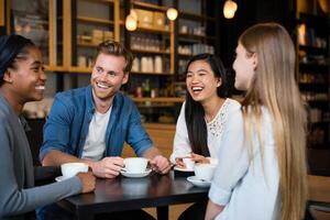Coffee Background Diverse Group of Young Adults Enjoying Coffee and Conversation in a Cafe photo