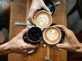 Coffee Background Three Hands Toasting with Coffee Drinks Latte Art Cafe Scene photo