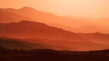 Majestic mountain ranges bathed in the warm glow of sunset creating a scenic landscape view photo