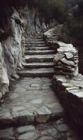 Ancient stone staircase winding up a mountain path through a rugged landscape offering adventure photo