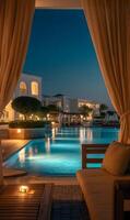Evening tranquility poolside luxury resort view of illuminated buildings and serene swimming pool glow photo