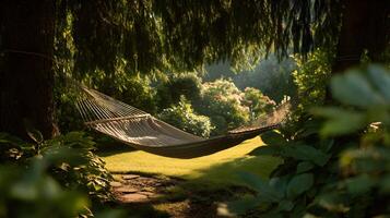 Idyllic scene of a hammock strung between trees in a peaceful garden setting photo