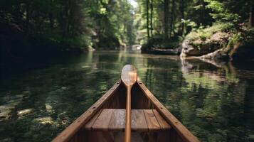 A serene canoe journey through the lush forest river offers peace and connection with nature photo